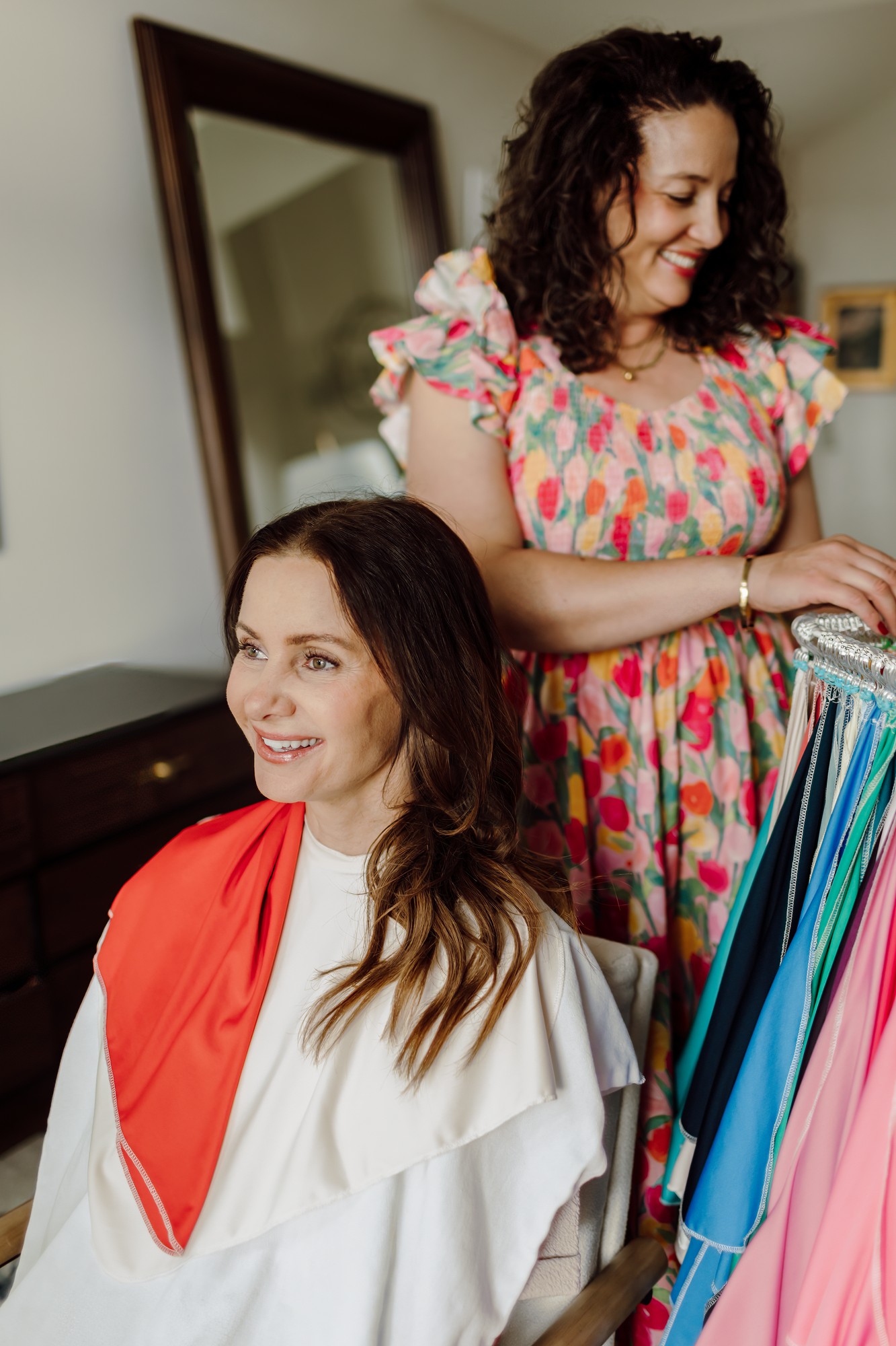 Consultant draping a red color swatch over her seated client